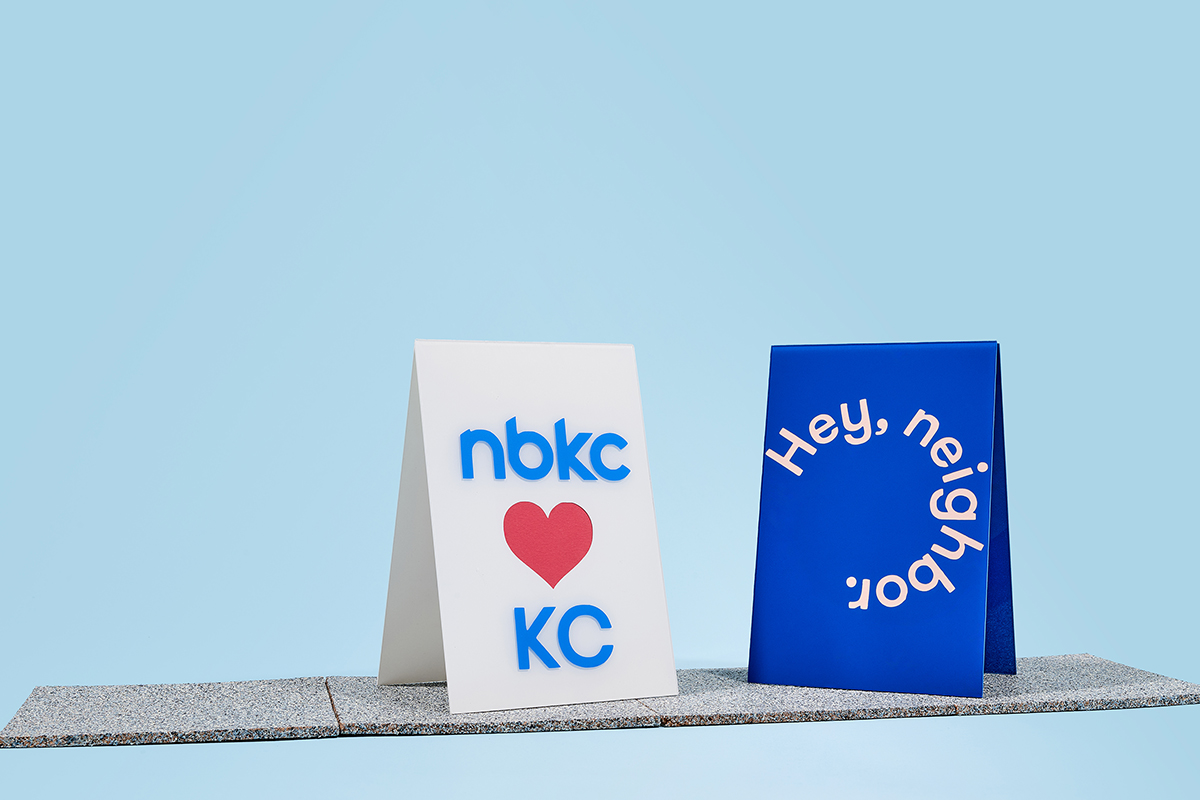 Two hands holding a green wallet symbolizing assistance